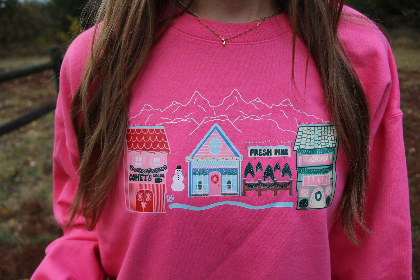 Comet's Christmas Village Sweatshirt Pink